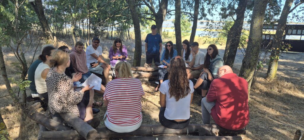 people sitting in a circle in the nature